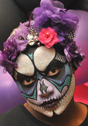 woman in a detailed blue and white face painting